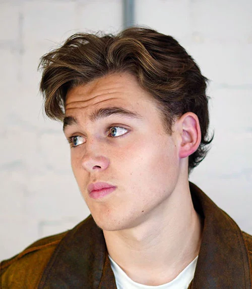 This medium flow with an off-center part is a trending longer men’s hairstyle