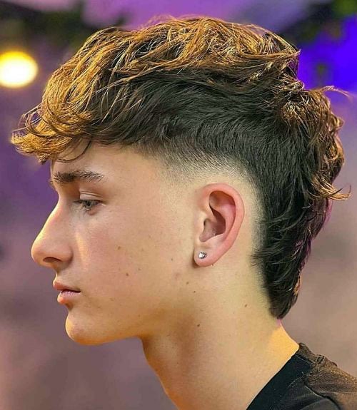 This modern mullet fade is an edgy, rebellious cut that allows for ample self-expression