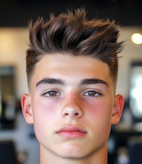 Textured spiky hair with a classy low taper fade is an edgy and bold look suitable