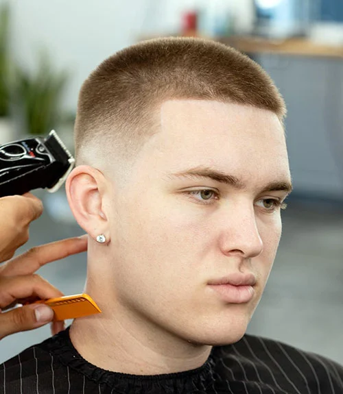 The buzz cut fade is simple, sharp and undeniably bold, characterized by aggressively blended